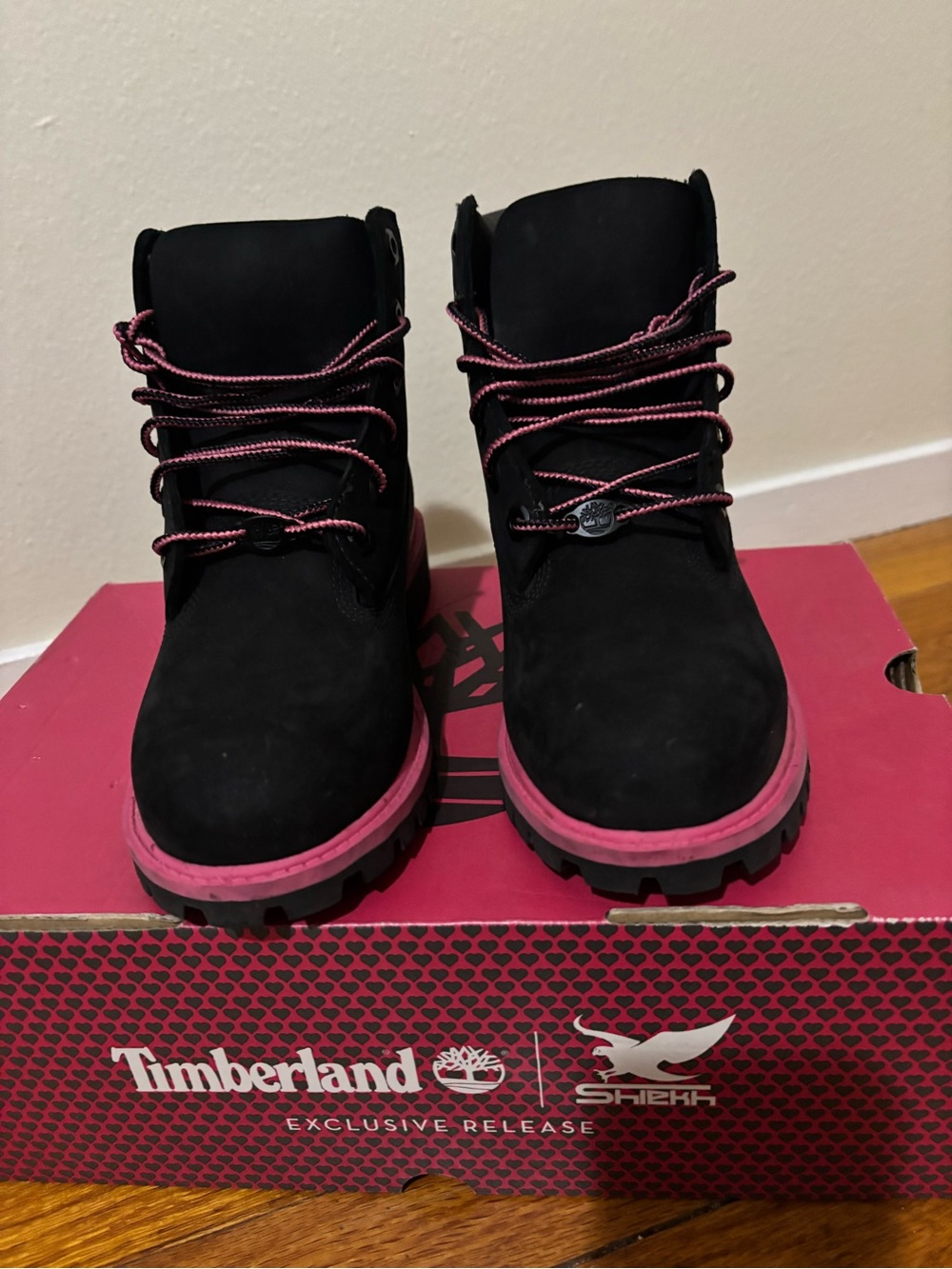 Timberland Juniors Black Boots with Pink Trim and Laces